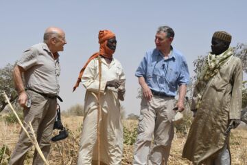 Volker Schlöndorff with Tony Rinaudo and locals in Niger. © World Vision